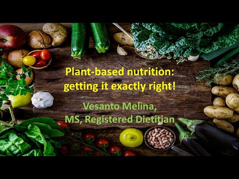 Fresh vegetables and herbs surrounding a wooden table with nutrition text overlay.